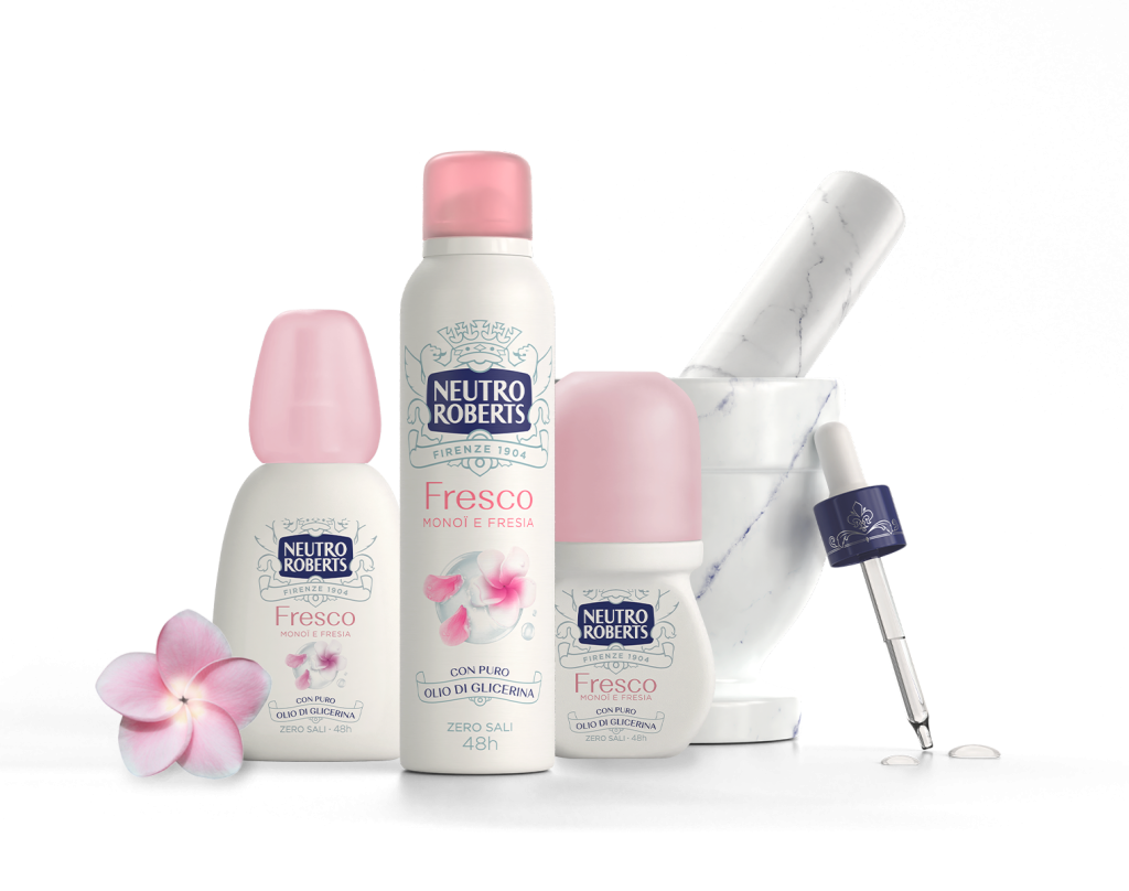 Prodotti Neutro Roberts Fresco Monoi e Fresia con fiori di plumeria e strumenti da laboratorio in sfondo.