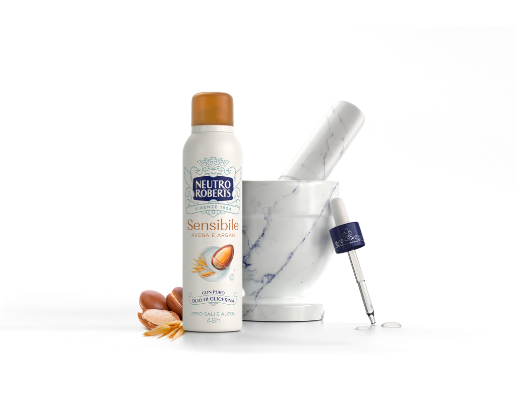 Spray Neutro Roberts Sensibile con mortaio, pipetta, semi di argan e avena su sfondo nero.