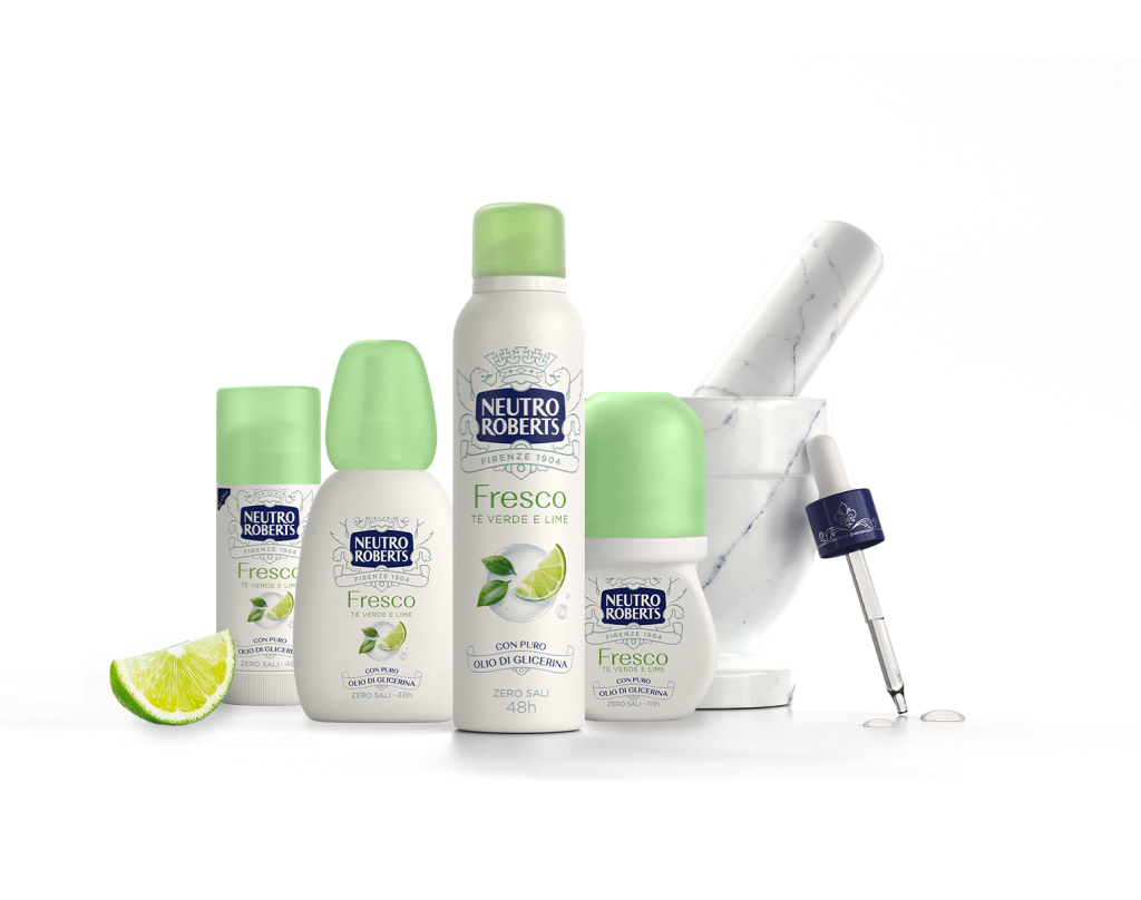 Prodotti Neutro Roberts Fresco con tè verde e lime, deodoranti spray e roll-on accanto a un mortaio e pestello di marmo.